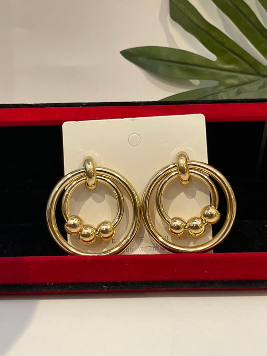 Gold earrings balls